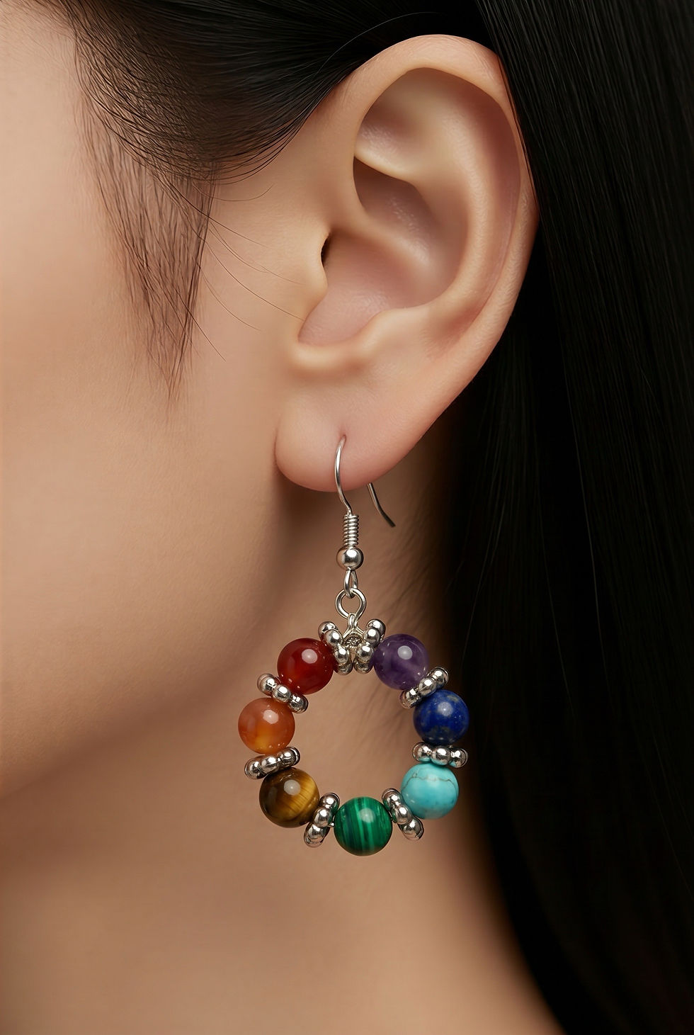 Silver wire circle hoop earrings featuring chakra gemstone beads on model
