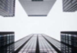 Buildings seen from the ground, illustrative of the English to Portuguese language services