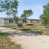 Rural Texas home on open land before residential water well planning