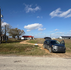 Water well budget planning for a rural property in Wharton County, TX, with a home, driveway, power access, and open land.