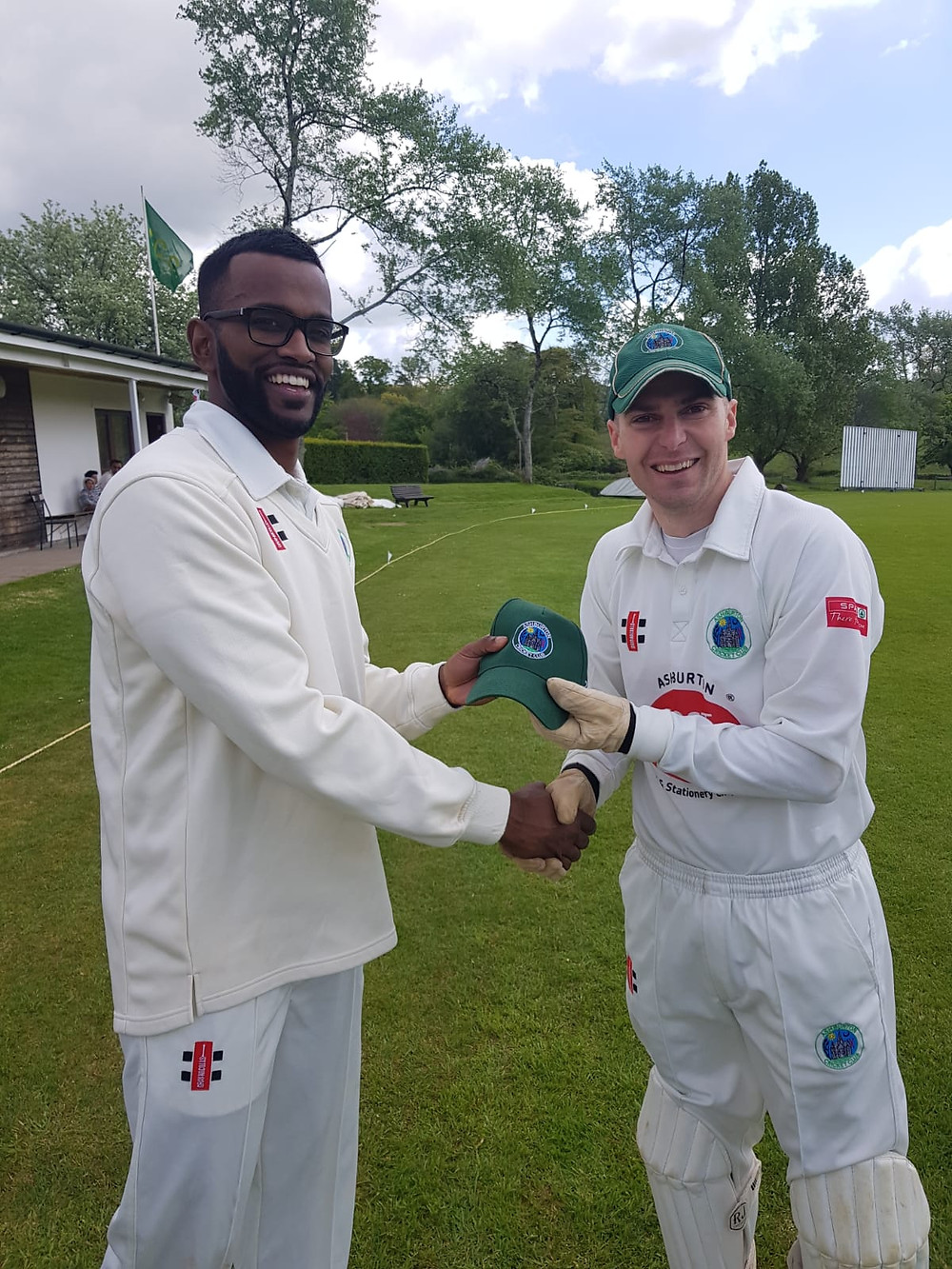 New overseas signing Arun Karthick being presented with his cap by skipper Ashley Berry