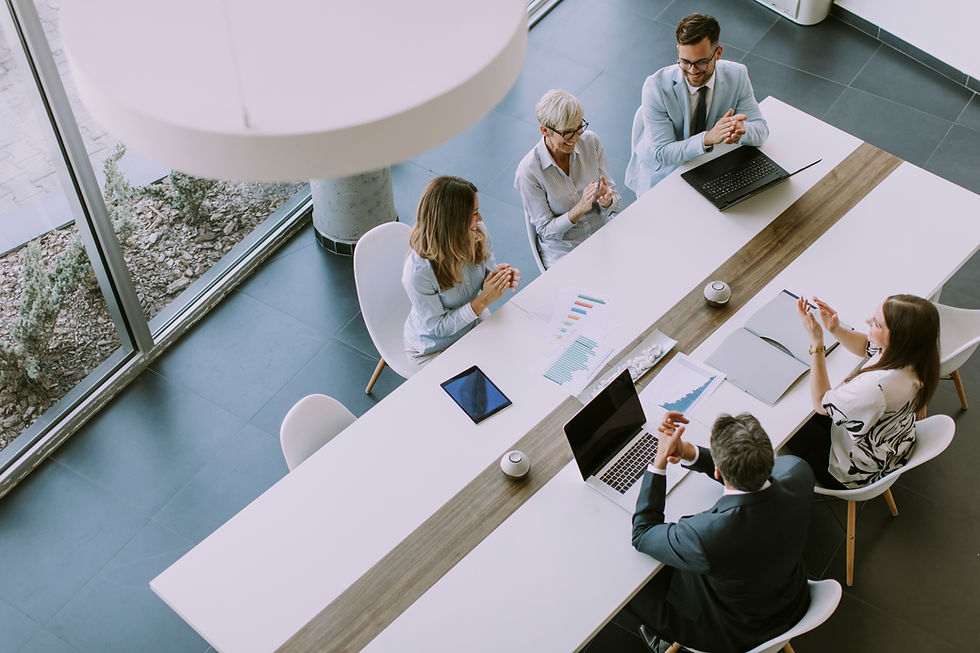 Aerial-view-at-group-of-business-people-working-together-and-preparing-new-project-on-a-me
