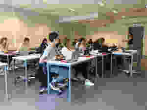 An image of a lesson being conducted in a classroom.
