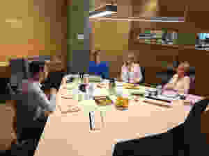 A group of ministers chat to me around a table