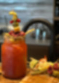 Canadian gin Caesar with Clamato juice and creative garnishes served in a glass