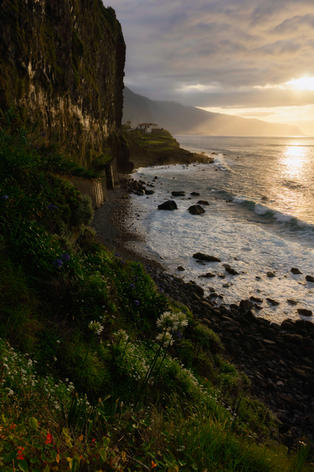 Scenic sunset over the rocky coastline of Madeira.