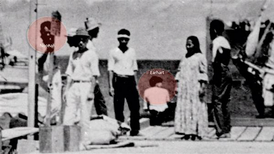 The photo shows a Japanese ship, Koshu, towing a barge with something that appears to be 38-feet-long — the same length as Earhart's plane.