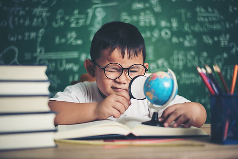 kid-observing-studying-educational-globe-model-classroom.jpg