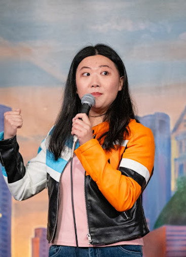 Cathy Zhao Headshot with Mic.JPG