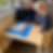five year old child building the Montessori decanomial square giving child a sensorial representatio