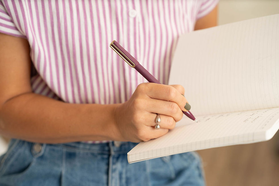 Jenya Tucker, owner of By Jenya, creating an organizing plan for a client. 