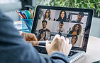 back-view-male-employee-speaking-video-call-with-diverse-colleagues-online-briefing-with-l