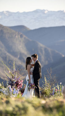 A couple exchanging vows at High Mountain Weddings