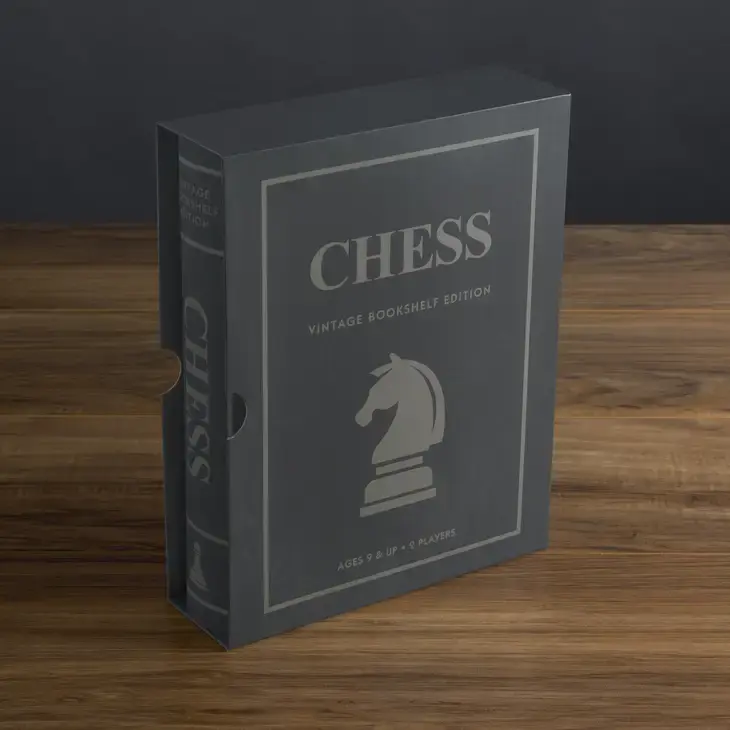 grey vintage faux book with chess inside.