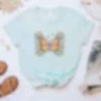 light blue shirt with colorful suicide awareness butterfly with semi colon.