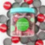 Sour cherry coke bottle gummies in jar.