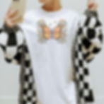 woman wearing white shirt with colorful suicide awareness butterfly with semi colon with checkered cardigan.