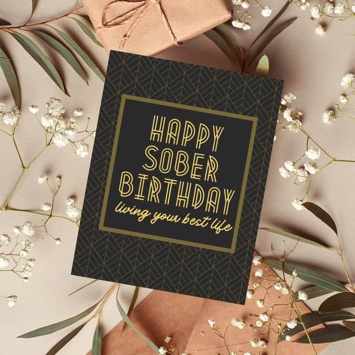 Thumbnail: Black card with gold writing "happy sober birthday"
