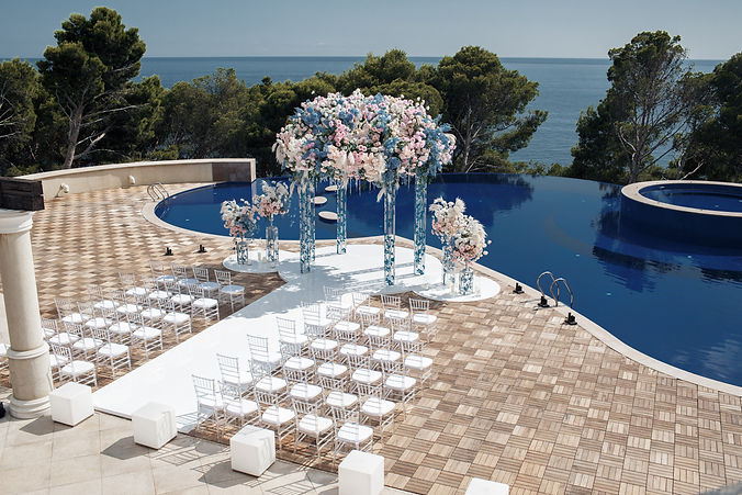 luxury-wedding-ceremony-near-pool-sea.jpg