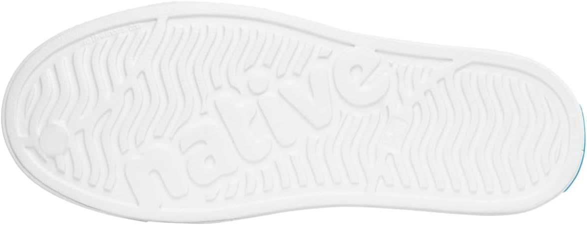 Bottom view of a white shoe sole with the brand name 'native' embossed in the center and a textured grip pattern around the edges."