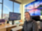 Peter James sitting at desk inside Bellingham Photography Gallery office