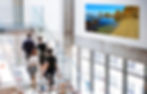 Shi Shi Beach landscape photograph displayed near corporate staircase interior