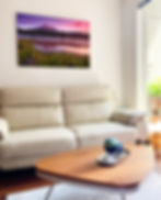 Mount Rainier landscape photograph mounted above couch in living room