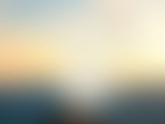 A doorway over mountains with a sunset and butterflies being released
