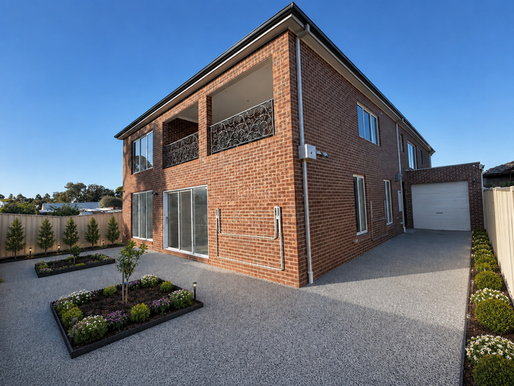 Modern two-story brick ALB HOMES residence with driveway.