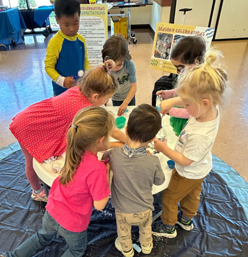 Campbell Community Center's Open House. They had face painters, robotics, the library, and Sensory Celebrations. All of the kids played at our tables.