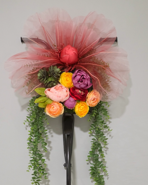 Custom flowers with orange and purple peonies.