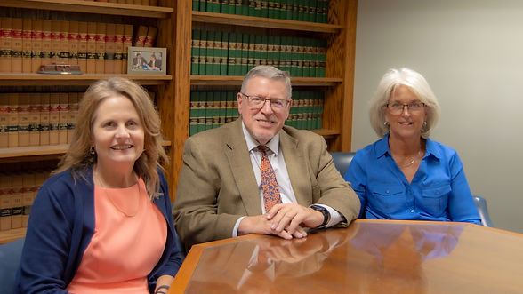 Robert Whitt and legal staff gathered around a conference table at the elder law and estate planning office in Mount Holly, NC