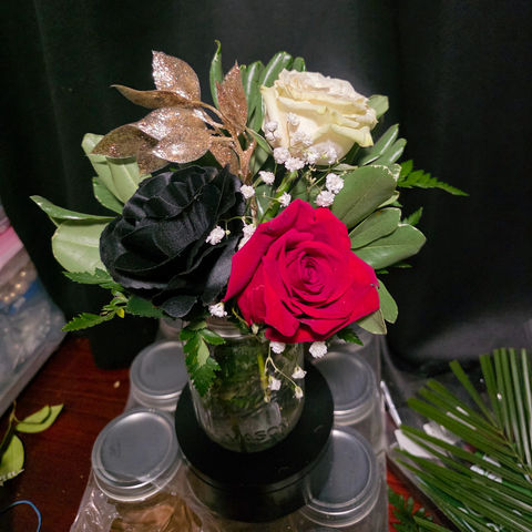 Red, black, and white rose vase.