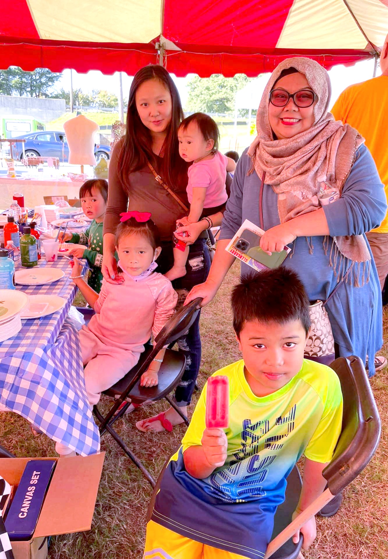 Families at the Doraville Art Festival community paint station