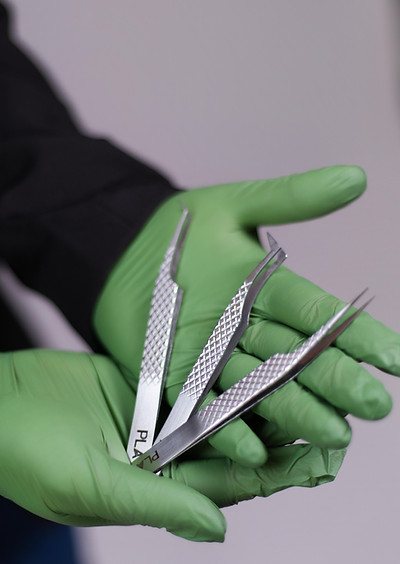 Chicago lash artist holding professional lash extension tweezers