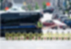 Waukesha Police officer standing behind MVB3X barriers blocking a street, ensuring public safety and traffic control.