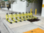 MVB3X barriers on sidewalk by building, separating pedestrians from traffic