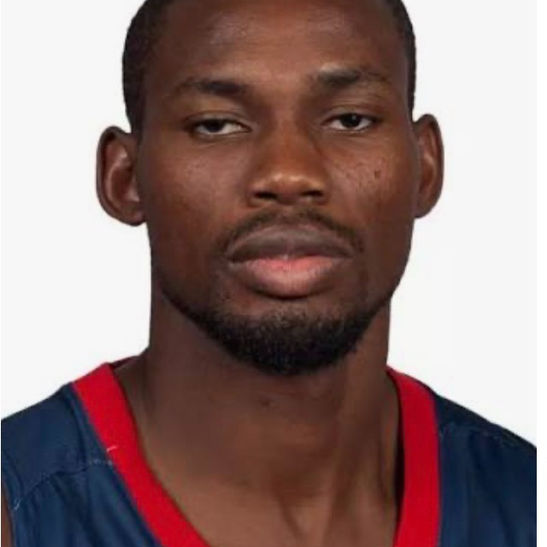 Professional male athlete in a navy and red jersey
