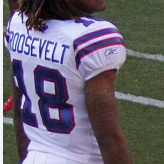 Naaman Roosevelt wearing number 18 on a football field.