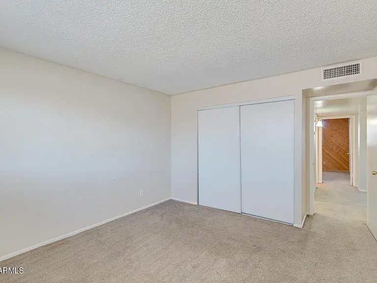 Before new fixtures, ceiling fans, luxury vinyl planking, new baseboards, new carpet, new closet doors