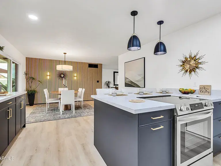 Fully remodeled kitchen in Scottsdale featuring modern fixtures, custom cabinets, upgraded plumbing, and new countertops.