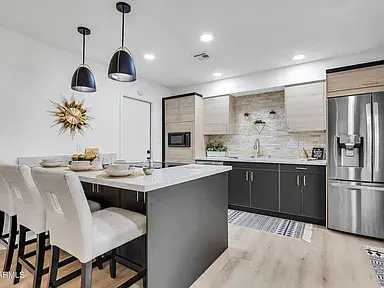 Scottsdale contemporary kitchen remodel with shaker cabinets, quartz counters, tile backsplash, and upgraded electrical.