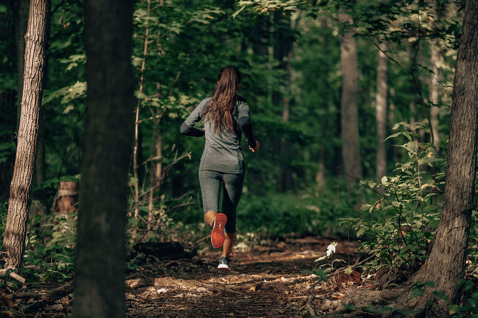 Exercising outdoors is healthy for active lifestyle runners. Autumn trail run woman runnin
