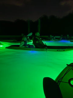 Father and daughter at night tour on the water