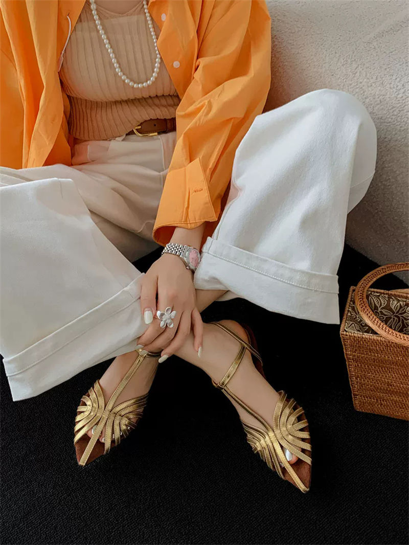 ZAROY gold Roman sandals with pointed toe and ankle strap.
