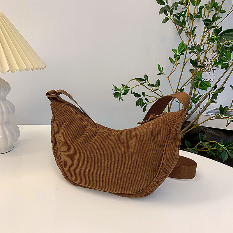 Thumbnail: Brown corduroy hobo shoulder bag on a white table