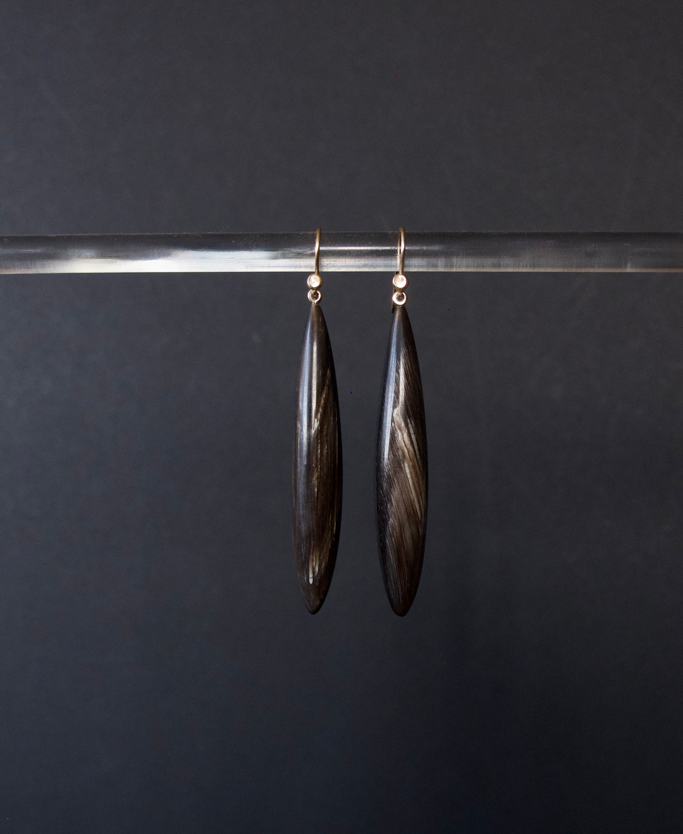 Skinny black horn drops with white veining