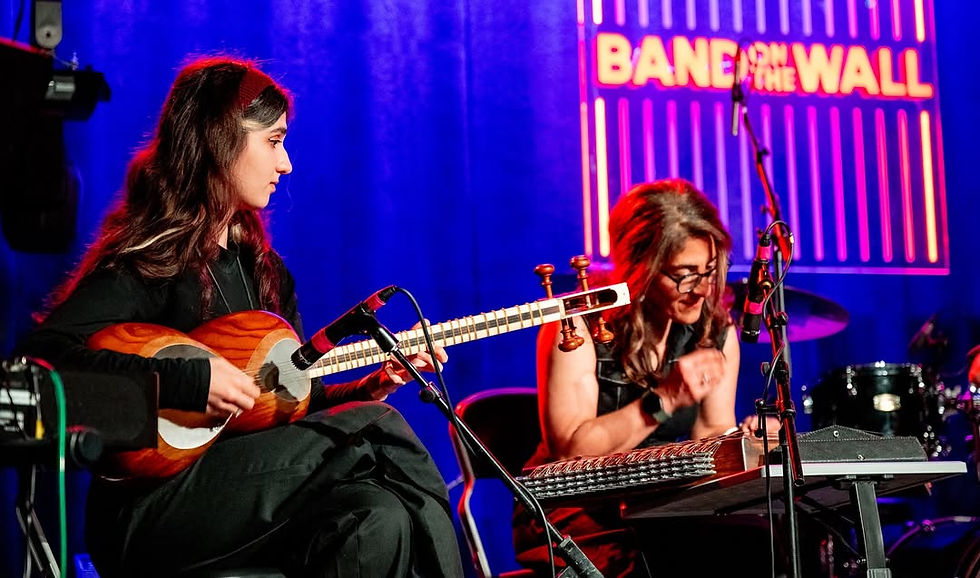 Hamsaz Ensemble musicians performing Setar and Santur during a live concert at Band on the Wall in Manchester.