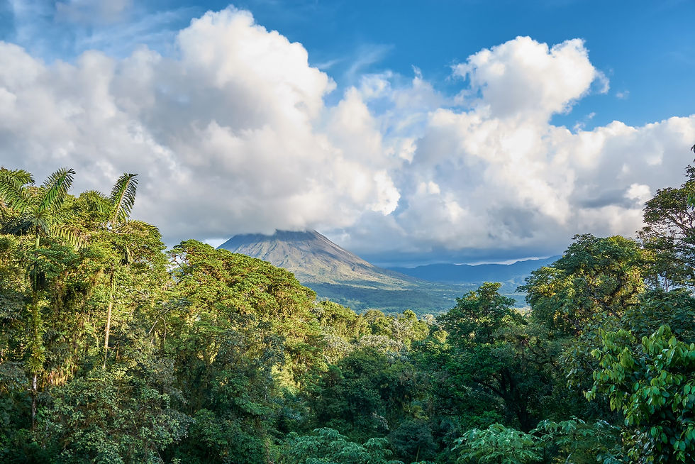 Arenal Volcano shrouded in clouds, a popular excursion destination for Costa Rica retreats