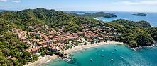 Aerial view of Las Catalinas beach town — a luxury retreat destination in Costa Rica